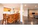 Open concept kitchen island features wood cabinets and marble countertops with bar stool seating at 841 16Th Avenue Nw Ln, Hickory, NC 28601