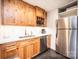 Stylish kitchenette features stainless steel appliances, wood cabinets, and marble countertops at 841 16Th Avenue Nw Ln, Hickory, NC 28601