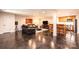 Spacious living area featuring a modern kitchen, comfortable lounge space, and a large television at 841 16Th Avenue Nw Ln, Hickory, NC 28601