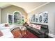 Bright living room with large arched window, neutral walls, and stylish furnishings at 841 16Th Avenue Nw Ln, Hickory, NC 28601