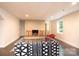 Cozy living room with a fireplace, window, and a geometrically patterned sofa at 841 16Th Avenue Nw Ln, Hickory, NC 28601