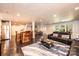 Comfortable living room with sleek black furniture, statement rug, and access to the backyard patio at 841 16Th Avenue Nw Ln, Hickory, NC 28601