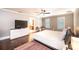 Bedroom featuring hardwood floors, two windows, and ceiling fan at 841 16Th Avenue Nw Ln, Hickory, NC 28601