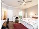 Bedroom featuring hardwood floors, ceiling fan, and ensuite bathroom at 841 16Th Avenue Nw Ln, Hickory, NC 28601