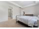 Bright main bedroom with a walk-in tiled shower and a view into the hall at 9547 Horsebit Ln, Concord, NC 28027