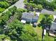 Aerial view of a backyard with a patio, shed and lush greenery, providing a private outdoor oasis at 9800 Ashley Farm Dr, Matthews, NC 28105