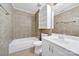 Full bathroom with a shower/tub, cabinet storage, and a clean, functional design at 9800 Ashley Farm Dr, Matthews, NC 28105