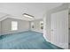 Light-filled bedroom with neutral walls and plush blue carpet at 9800 Ashley Farm Dr, Matthews, NC 28105