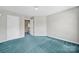 Well-lit bedroom with neutral walls and a spacious layout, perfect for personalization at 9800 Ashley Farm Dr, Matthews, NC 28105