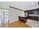 Spacious kitchen with a center island, dark wood cabinetry, and stainless steel appliances at 9800 Ashley Farm Dr, Matthews, NC 28105