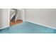 Open living area with hardwood floors and plush carpeting at 9800 Ashley Farm Dr, Matthews, NC 28105