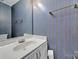 Compact powder room with wallpaper and vanity at 9800 Ashley Farm Dr, Matthews, NC 28105