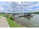 Community dock featuring boat slips and waterfront access with scenic views of the lake at 103 Pamlico Ln, Mooresville, NC 28117