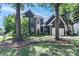 Charming two-story home with a well-maintained yard and mature trees offering curb appeal at 103 Pamlico Ln, Mooresville, NC 28117