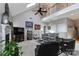 Spacious living room with vaulted ceilings, skylight, fireplace, and comfortable seating area at 103 Pamlico Ln, Mooresville, NC 28117