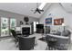 Bright living room showcasing a cozy fireplace, modern furnishings, vaulted ceiling and skylight at 103 Pamlico Ln, Mooresville, NC 28117