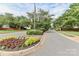 Landscaped street view with mature trees and manicured flowerbeds adds curb appeal to the neighborhood at 103 Pamlico Ln, Mooresville, NC 28117