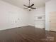 Spacious bedroom with hardwood floors, a fan, and two closets at 110 College St, Marshville, NC 28103