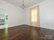 Bright dining room featuring wood floors, large window and a chandelier at 110 College St, Marshville, NC 28103