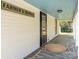 Inviting front porch with stone floor, 'Farmer's Market' sign, and a bright, light blue ceiling at 110 College St, Marshville, NC 28103