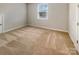 A simple bedroom provides a clean canvas with neutral walls and carpeting at 1332 Kings Grove Dr # Lot 18, York, SC 29745