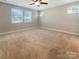 Spacious bedroom featuring neutral carpet, natural light from windows, and a ceiling fan at 1332 Kings Grove Dr # Lot 18, York, SC 29745