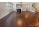 Open concept living room with hardwood floors, fireplace, and staircase at 1332 Kings Grove Dr # Lot 18, York, SC 29745