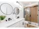 Elegant bathroom showcasing dual sinks, modern fixtures, and a glass-enclosed shower at 135 Brookview Dr, Shelby, NC 28152