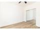 Bright bedroom features a ceiling fan, wood-look floors, and a mirrored sliding door closet at 135 Brookview Dr, Shelby, NC 28152