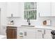 Kitchen featuring white cabinets, stainless steel appliances, subway tile backsplash, and light countertops at 135 Brookview Dr, Shelby, NC 28152