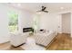 Bright living room featuring a modern fireplace, ample natural light and neutral decor at 135 Brookview Dr, Shelby, NC 28152