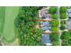 Aerial view of a home showcasing mature landscaping, with an outlined property at 13824 Glen Abbey Dr, Charlotte, NC 28278