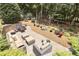 Secluded backyard with fire pit, sitting areas, and mature trees at 13824 Glen Abbey Dr, Charlotte, NC 28278