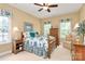 Comfortable bedroom features two windows, a decorative bed frame, and coordinated window valances at 13824 Glen Abbey Dr, Charlotte, NC 28278