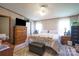 Bedroom with natural lighting, a TV, and a chest of drawers at 1495 Leonards Fork Church Rd, Lincolnton, NC 28092