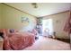 Bedroom with a pink carpet and Hello Kitty decor at 1495 Leonards Fork Church Rd, Lincolnton, NC 28092