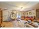 Cozy living area with a hanging chair, comfortable seating, and plenty of natural light at 1495 Leonards Fork Church Rd, Lincolnton, NC 28092