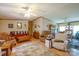 Open-concept living space with an adjacent dining area and cozy seating arrangements at 1495 Leonards Fork Church Rd, Lincolnton, NC 28092