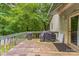 Spacious back deck offering outdoor dining with a grill and peaceful surrounding greenery at 1713 Poe Cir, Hickory, NC 28601