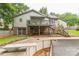 Green backyard with upper wood deck overlooking the in-ground pool at 1713 Poe Cir, Hickory, NC 28601
