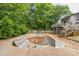 Green backyard with upper wood deck and in-ground pool at 1713 Poe Cir, Hickory, NC 28601