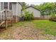 Green backyard with wood deck and stairs at 1713 Poe Cir, Hickory, NC 28601