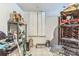 Unfinished basement with white tile floor and storage at 1713 Poe Cir, Hickory, NC 28601