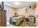 Cozy bedroom featuring a bed, dresser, mini fridge and playful decor at 1713 Poe Cir, Hickory, NC 28601