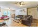 Inviting living room with wood floors, ceiling fans, and sliding door to outdoor deck at 1713 Poe Cir, Hickory, NC 28601