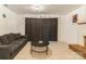 This living room offers a comfortable seating area with tile floors and a fireplace, perfect for relaxation and entertaining at 1713 Poe Cir, Hickory, NC 28601