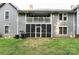 Screened in patio and balcony overlooking a yard with green grass at 1735 Robinwood Rd, Gastonia, NC 28054
