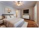 Bedroom with hardwood floors, a ceiling fan, and a large bed with white linens at 1735 Robinwood Rd, Gastonia, NC 28054