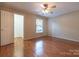 Large bedroom with hardwood floors, a ceiling fan, and a window at 1735 Robinwood Rd, Gastonia, NC 28054