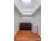 Walk-in closet with built-in shelving and wood-look floors at 1735 Robinwood Rd, Gastonia, NC 28054
